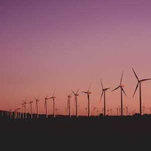 Silhouetted wind turbines at sunset in Zahara de los Atunes, Spain.