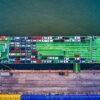 Aerial view of a car transport ship docked at Bekasi port, Indonesia.