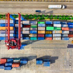 Colorful cargo containers organized at a shipping yard in North Jakarta, Indonesia.