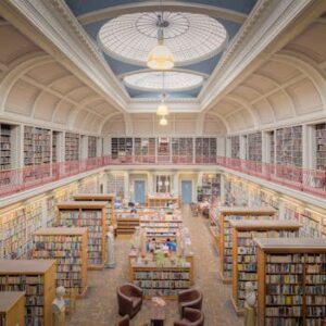 Beautiful interior of a historic library in England with bookshelves and dome ceiling.