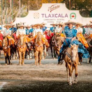 Vibrant charro riders in traditional attire at the Tlaxcala charro event, showcasing Mexican equestrian culture.