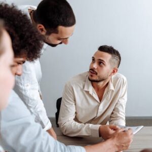 Young team discussing ideas collaboratively in a modern office setting.
