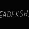 Chalk text spelling 'Leadership' on a blackboard, symbolizing guidance and authority.