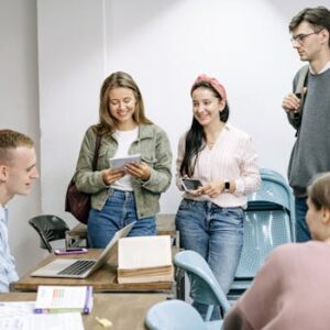 A diverse group of college students engaging in a lively study session indoors.