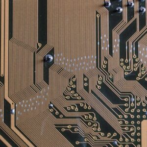 Detailed view of a circuit board with intricate gold traces.