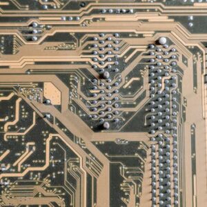 Detailed view of intricate circuitry on a computer motherboard.