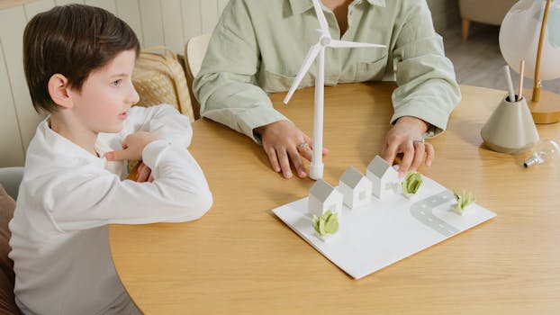 A child explores renewable energy models in a classroom setting.