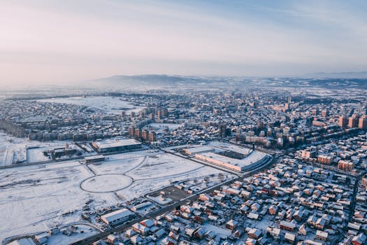 A stunning aerial view of Kruševac covered in snow during winter, showcasing urban architecture.