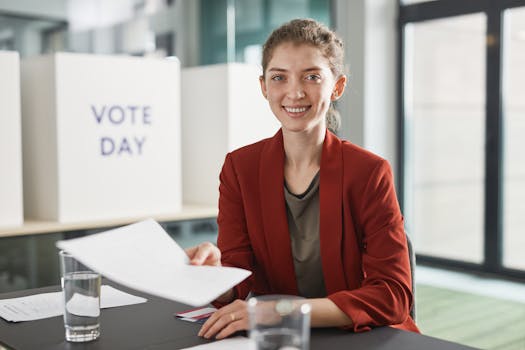 Cheerful young woman sitting indoors, holding documents during vote day with a smile.
