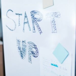 Creative startup concept handwritten on a whiteboard, symbolizing innovation in business.