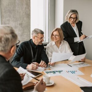 A diverse group of business professionals engaged in a strategic meeting.