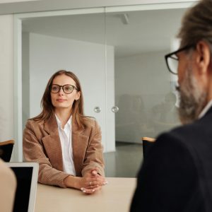 Business professionals engaged in a meeting in a modern office setting, focusing on collaboration and planning.