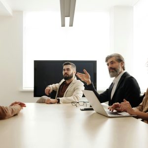 Professional team engaged in a business meeting discussing strategy in a modern office environment.