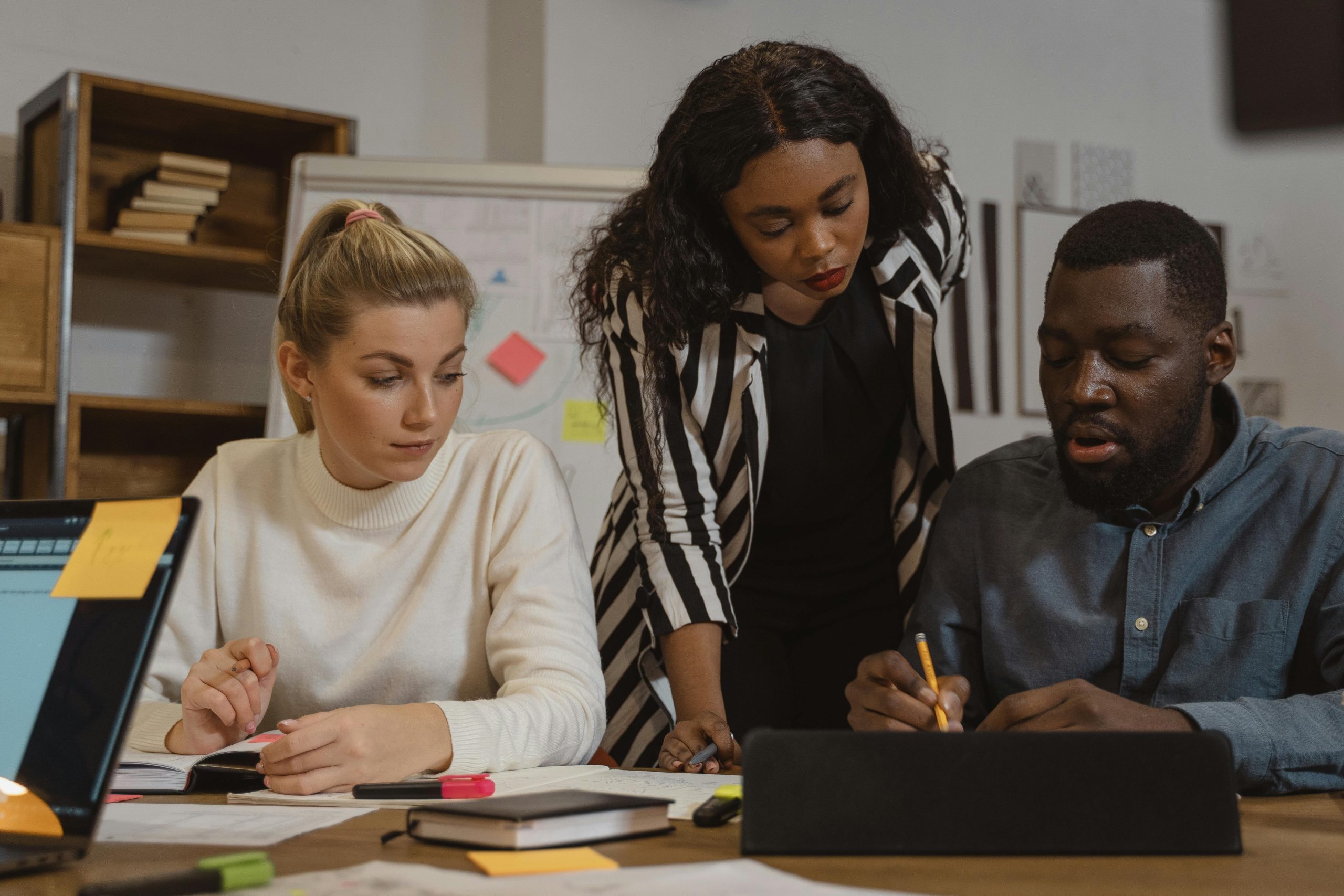 Multicultural office environment where diverse team members collaborate on a project.