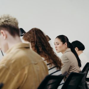 A multicultural office team engaged in focused work, emphasizing teamwork and diversity.