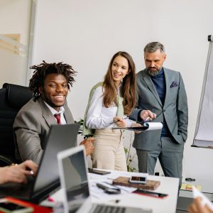 Business team collaborating during a meeting in a modern office space with charts.